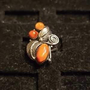Sterling silver with orange spiny oyster shell pieces.